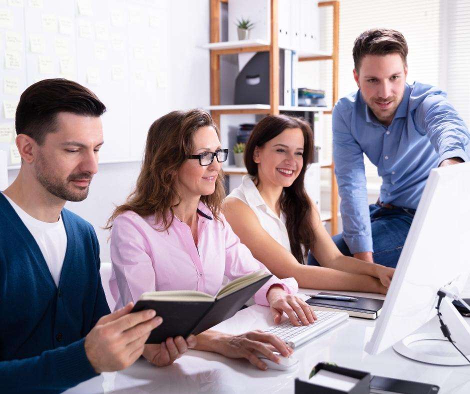 accountants working with manufacturing accounting software
